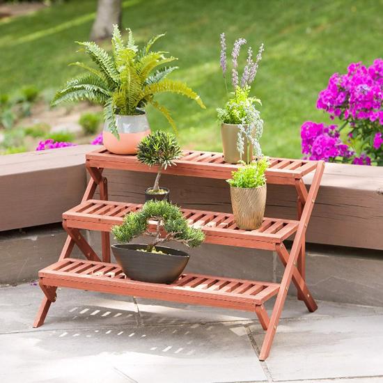 Leisure Season 3-Tier Wooden Step Plant Stand (PS6133) Grips your plant collection and carry semblance to your deck or backyard.